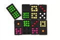 Set of dominoes, Domino lie on, Close up old black color dominoes with colorful dot pieces isolated on white background