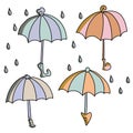 Set of doodle colorful umbrellas and raindrops, outline vector illustration Royalty Free Stock Photo
