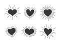 Set of doodle heart shaped symbols with retro styled sun rays. Collection of different hand drawn romantic hearts for Royalty Free Stock Photo