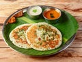 Set Dosa, a south Indian traditional and popular Breakfast served with chutney and sambar over a rustic wooden background, Royalty Free Stock Photo