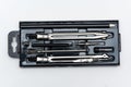 Tools for drawing circles and lines in a metal box on a white background Royalty Free Stock Photo