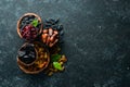 Set of dried fruits. Raisins, cranberries, dates and prunes. Top view. Royalty Free Stock Photo