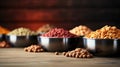 Set of Dry cat food in bowl on wooden background. Vitamins and nutrients for good health and energy of pets. Copy space. Royalty Free Stock Photo