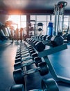 A set of dumbbells with a water bottle in a modern gym Royalty Free Stock Photo