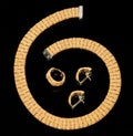 Set of earrings, ring and golden bracelet