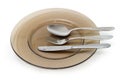 Set of eating utensils on the dark glass dish