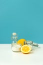 Set of eco cleaning products. Eco sponges, lemons, apple vinegar, citric acid and soda on blue background Royalty Free Stock Photo