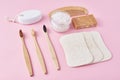 Set of eco friendly personal hygiene objects on a pink background. Bamboo toothbrush, wooden comb, sponge, soap and sea salt, top Royalty Free Stock Photo