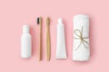 Set of eco-friendly toothbrushes, toothpaste and other tools on pink background. Royalty Free Stock Photo