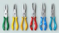 A set of eight pliers with different colored handles arranged in a row Royalty Free Stock Photo