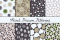 Set of eight seamless textures. Patterns with spheres, round and oval elements and spots. Abstract forms drawn a wide pen and ink. Royalty Free Stock Photo