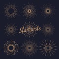 A set of eight solar bursts on a dark background. Solar bursts, elements of a shining star. Royalty Free Stock Photo