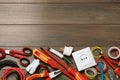 Set of electrician`s tools and accessories on wooden table, flat lay. Space for text Royalty Free Stock Photo