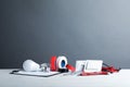 Set of electrician`s tools on table against gray background Royalty Free Stock Photo