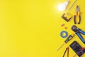 Set of electrician`s tools on yellow background. Flat lay composition with electrician`s tools and space for text yellow Royalty Free Stock Photo