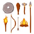 A set of elements of the Stone Age. Cartoon style illustration. Stone wheel, spear, ax, wooden bob, torch, bow, arrow and fire. Pr