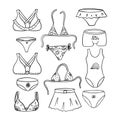 Set of elements of women`s underwear, bras, panties and swimwear. Black and white  illustration in Doodle style. The object Royalty Free Stock Photo