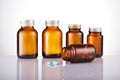 Set of empty brown glass medicine bottles. Amber bottle samples, with drugs Royalty Free Stock Photo