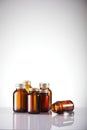 Set of empty brown glass medicine bottles. Vertical composition Royalty Free Stock Photo