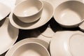 Set of empty and clean ceramic bowls and plates with simple round and curved shapes Royalty Free Stock Photo