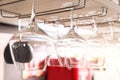 Set of empty clean glasses on bar racks Royalty Free Stock Photo