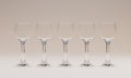 Set of 5 Empty 3D Rendered Wine Glasses Over White Backdrop Royalty Free Stock Photo