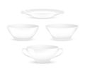 Set of empty white plates and bowls. Kitchen utensils isolated