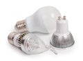 Set of 3 energy saving LED light-emitting diode bulbs, with sockets type E27 and GU10  isolated on a white background, close up Royalty Free Stock Photo