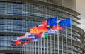 Set of European flags in front of the European Parliament Royalty Free Stock Photo