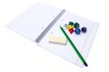 Set of exercise book, pencil, rubber and dices isolated on white Royalty Free Stock Photo