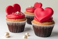 A set of exquisite Valentine\'s Day themed cupcakes, each adorned with a red fondant heart. Royalty Free Stock Photo