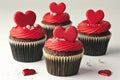 A set of exquisite Valentine\'s Day themed cupcakes, each adorned with a red fondant heart.