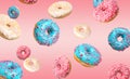 Set of falling delicious donuts on background