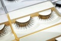 Set with false eyelashes in pack as background Royalty Free Stock Photo