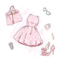 A set of fashionable women`s clothing and accessories. Dress, bag, shoes with heels, lipstick, perfume and glasses. Royalty Free Stock Photo