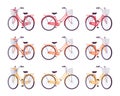 Set of female bicycles with basket in red, orange, yellow colors