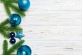 Set of festive balls, fir tree and Christmas decorations on wooden background. Top view of New Year ornament concept with copy Royalty Free Stock Photo