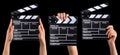 Set of film clapper boards and human hands isolated on black background Royalty Free Stock Photo