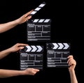 Set of film clapper boards and human hands isolated on black background Royalty Free Stock Photo