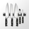 A set of five kitchen knives is displayed on a magnetic wall strip Royalty Free Stock Photo
