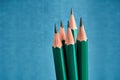 Five identical lead graphite pencils with sharp sharpening, blue