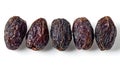 Set of five semi-dry dates, or date palm fruits isolated on white background. Royalty Free Stock Photo