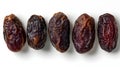 Set of five semi-dry dates, or date palm fruits isolated on white background. Royalty Free Stock Photo