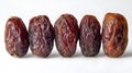 Set of five semi-dry dates, or date palm fruits isolated on white background. Royalty Free Stock Photo