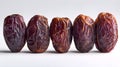 Set of five semi-dry dates, or date palm fruits isolated on white background. Royalty Free Stock Photo