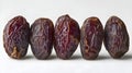 Set of five semi-dry dates, or date palm fruits isolated on white background. Royalty Free Stock Photo