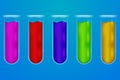 Set of five transparent glass chemical tubes with colorful fluid