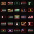 A set of 25 flags of different Asian countries, in neon style. On the background of a brick wall with a shadow.