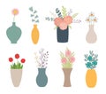 Set of flowers in vases on white