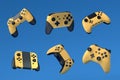 Set of flying gamer joysticks or gamepads on blue background